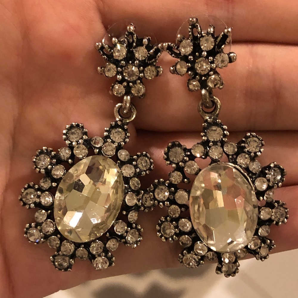 Dangling costume jewelry earrings with fake stones